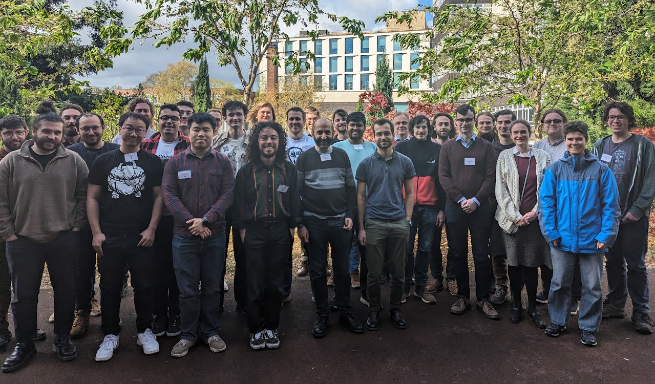 The SYCO 12 attendees, standing in front of some trees