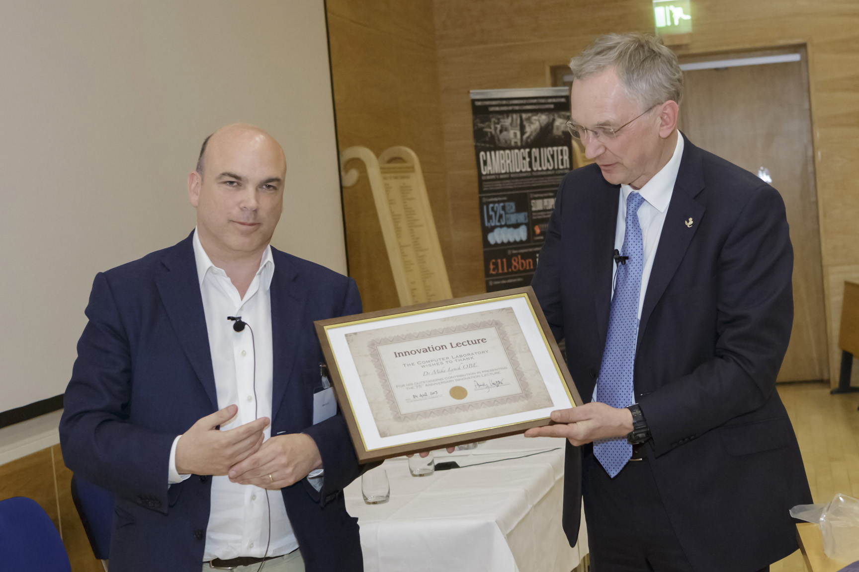 Professor Andy Hopper (right) presents Dr Mike Lynch with a commemorative certificate
