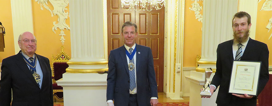 Jonas Fiala receives his award from the Lord Mayor and the Master of the Gold and Silver Wyre Drawers