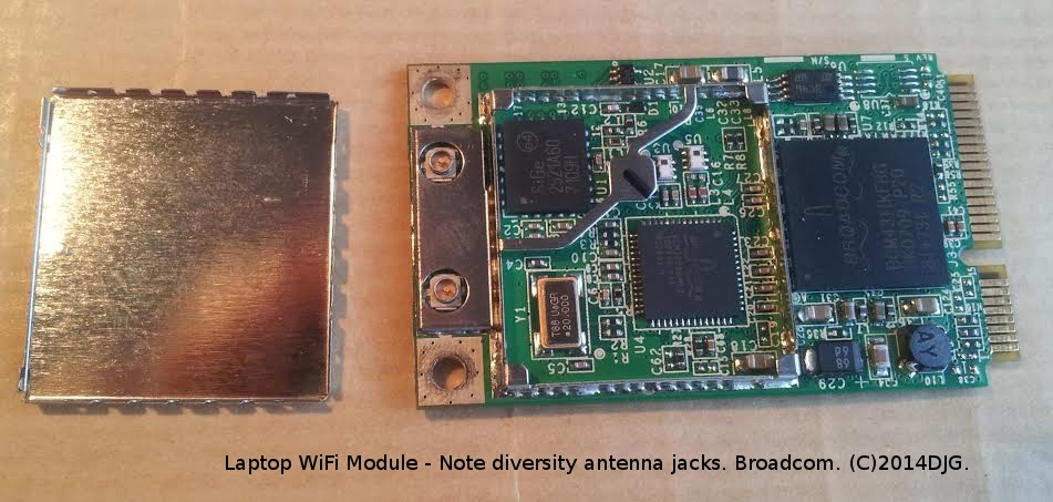 WiFi laptop module. Shielding lid, shown left, has been lifted off.